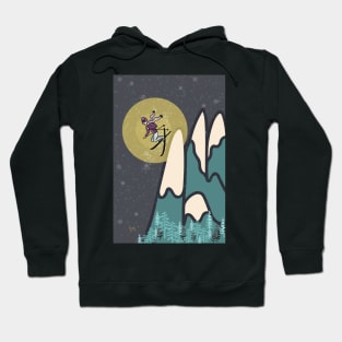 Freestyle woman skier on snowy mountain at night Hoodie